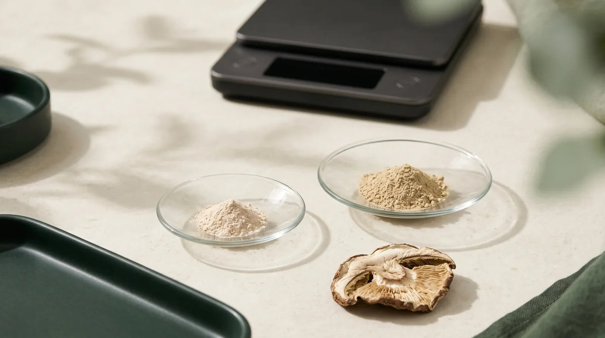Two powder samples in glass weighing dishes beside a scale.